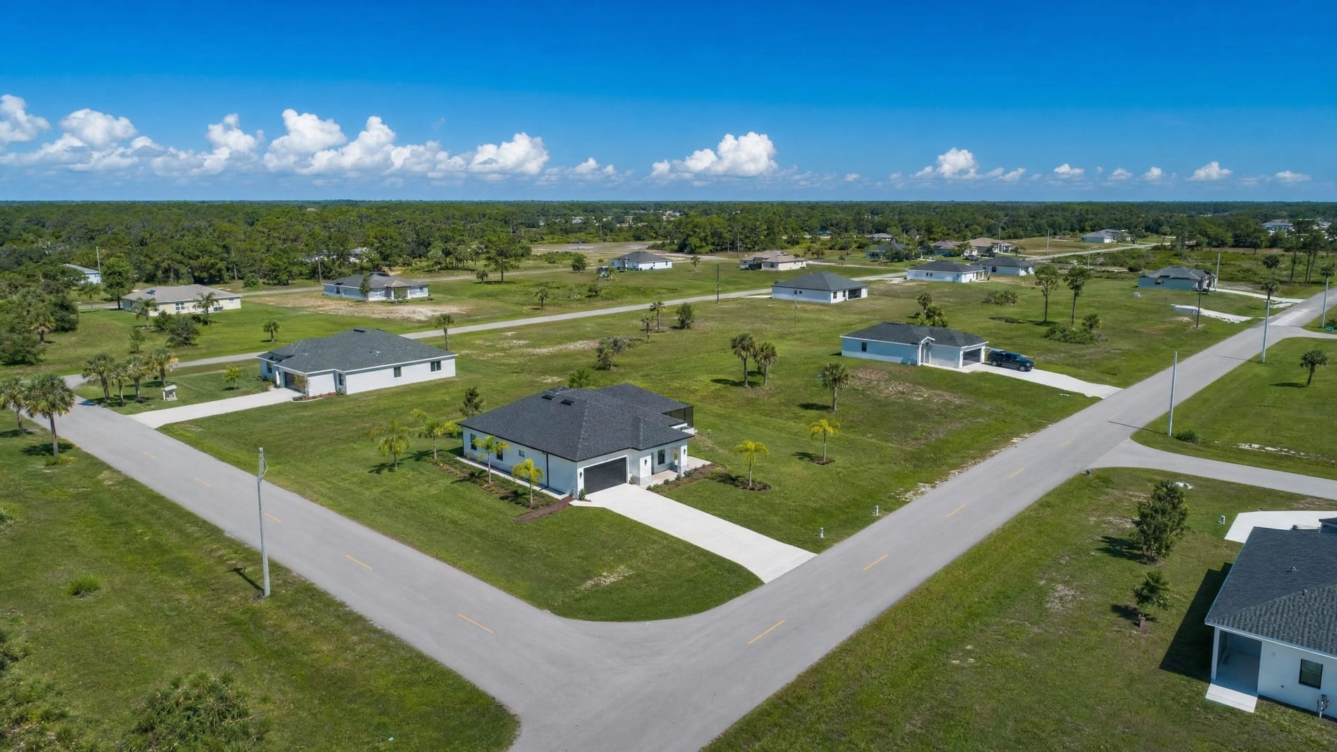 Aerial view of new-construction homes on large lots in Lehigh Acres, Florida